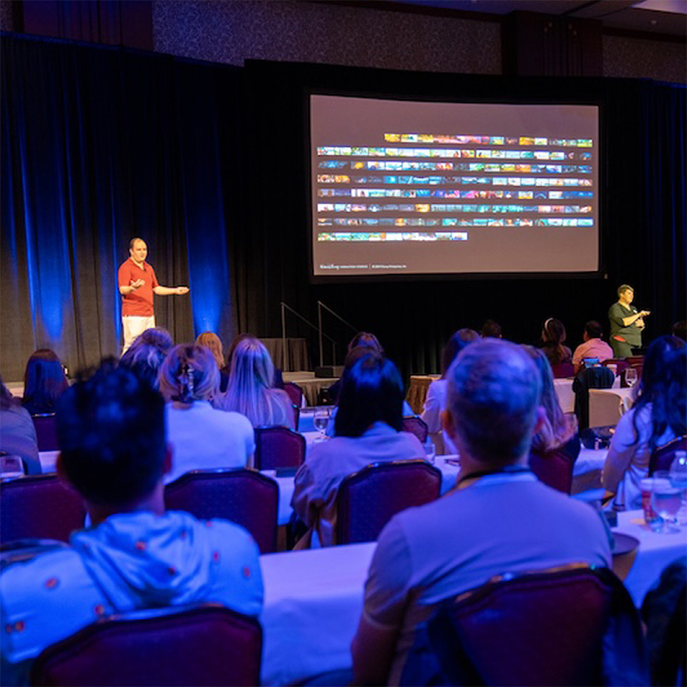 A photo of me speaking to the audience, with the audience in the foreground